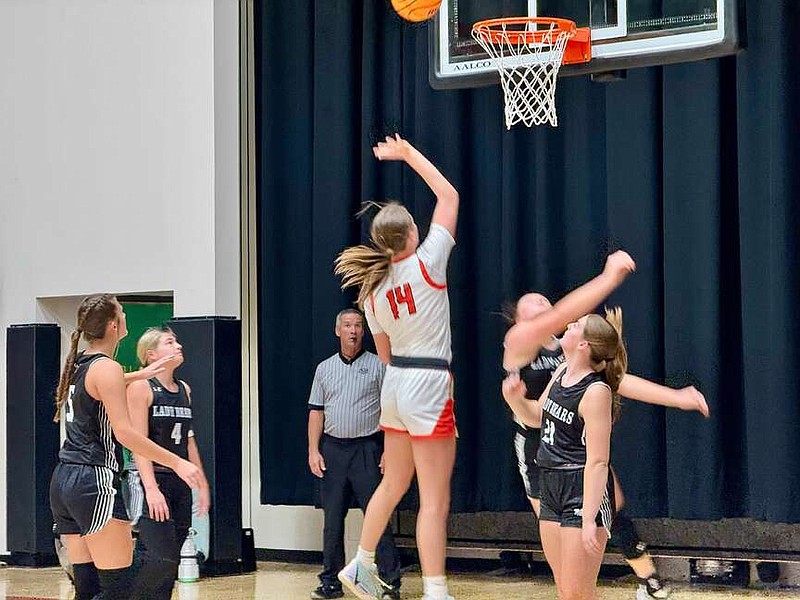 Cutter Morning Star senior Libby Hood (14) puts up an inside shot during the first quarter of Tuesday night's home game against Woodlawn at Eagle Arena. Hood scored 20 points in the contest. (The Sentinel-Record/Bryan Rice)