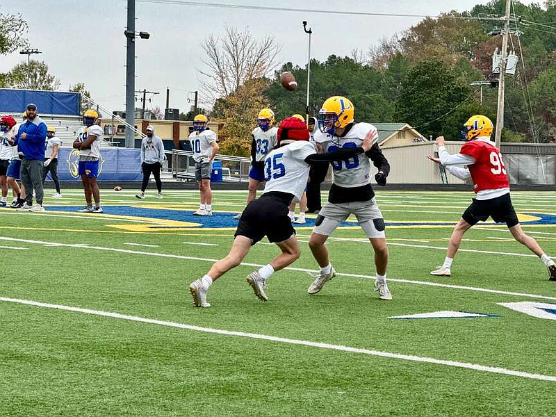 Lakeside senior defensive back Landon Rhea (35) sheds a block to stop a double pass in practice on Wednesday at Chick Austin Field. Lakeside travels to Farmington today for the Class 5A playoffs semifinals. (The Sentinel-Record/Bryan Rice)