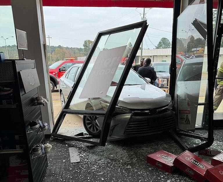 Vehicle after it was driven through the front window of Shoe Sensation, Nov. 27
(photo by Kodey Cook)