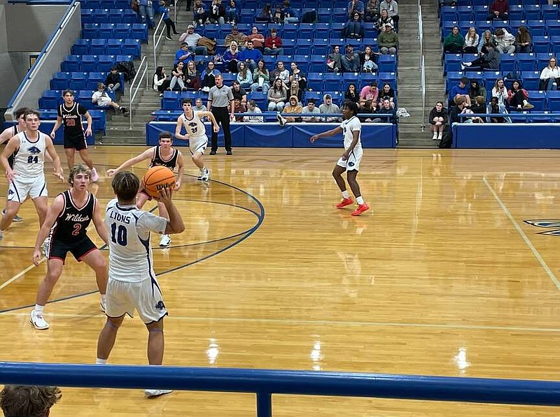 Jessieville sophomore Jacob Graves (10) looks for the open man Tuesday night during the Lions' home matchup against Harding Academy at Jessieville Sports Arena. (The Sentinel-Record/Braden Sarver)