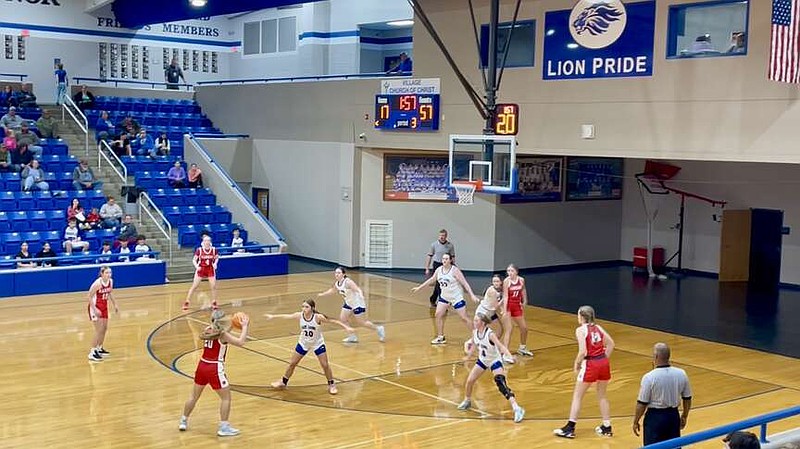 The Jessieville Lions (in white) battle Harding Academy Tuesday night at Jessieville Sports Arena. (The Sentinel-Record/Braden Sarver)