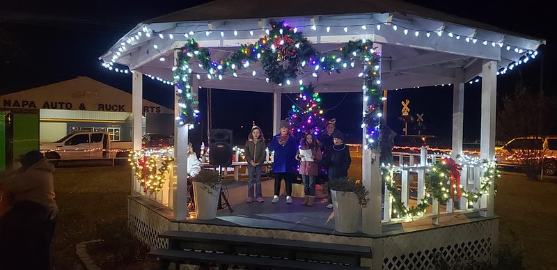 Locals sing Christmas Carols in the gazebo
(photo by Mark Suhar)