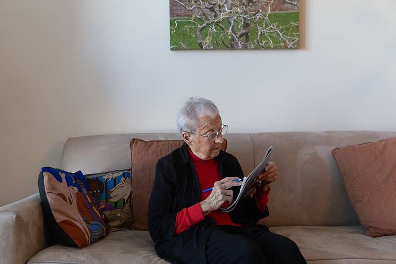 Hilda Jaffe, 102, in her apartment in New York. Jaffe enjoys doing puzzles, reading, volunteering and attending cultural events. MUST CREDIT: Jackie Molloy for KFF Health News