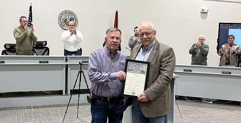 Justice of the Peace Ray Owen, left, receives a special citation Rep. Richard McGrew presents on behalf of the state House of Representatives Monday at the Garland County Armory Building. (Courtesy Susan Ashmore)