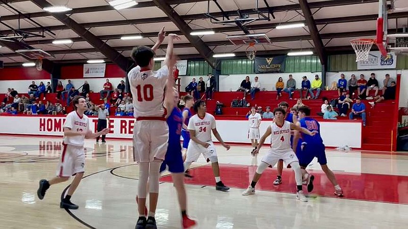 Mountain Pine junior Gavyn Redden shoots from long range Friday night at home against Caddo Hills. (The Sentinel-Record/Braden Sarver)