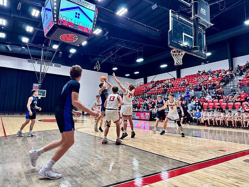 Cutter Morning Star sophomores Bentley Gigerich (13) and Carson Weldon (24) defend a shot by Dierks shooting guard Dylan Moore (13) on Friday at Eagle Arena. (The Sentinel-Record/Bryan Rice)