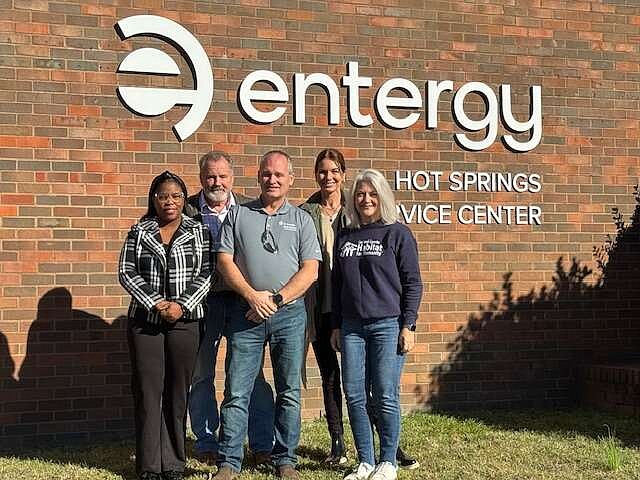 Entergy Arkansas officials recently awarded over $10,000 to Garland County Habitat for Humanity for its participation in the Core Continuous Energy Improvement program. (Submitted photo)