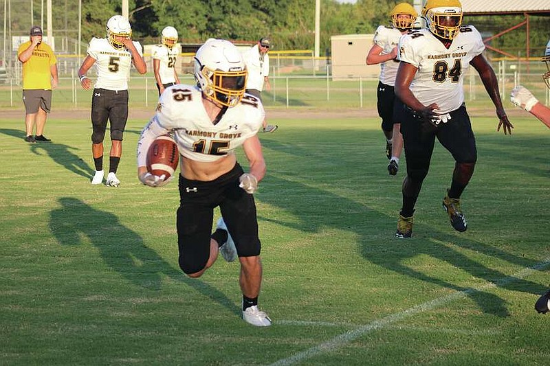 Photo by Michael Hanich (Archives)
Keegan Jones carries the ball during a Fall scrimmage. The versatile student athlete earned All Conference Second Team honors.