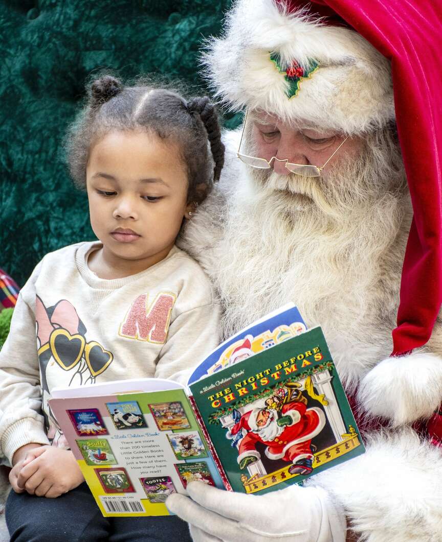 MERRY CHRISTMAS: Busy as he is, the jolly ol' elf takes time out