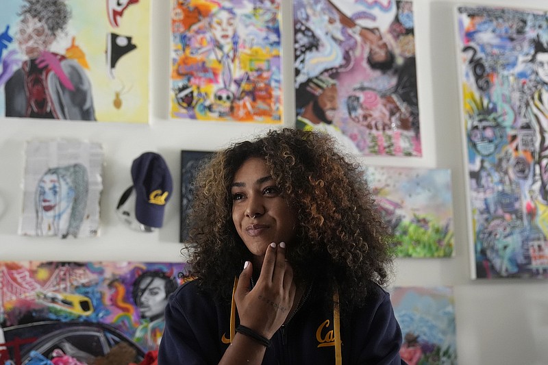 California basketball player Jayda Noble is interviewed in front of her artwork in Berkeley, Calif., Monday, Oct. 21, 2024. (AP Photo/Jeff Chiu)