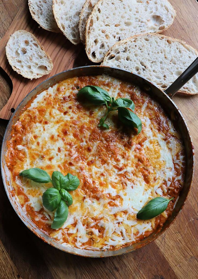 This cheesy bean dish is made in one pan and is best served with bread for scooping. (Gretchen McKay/Pittsburgh Post-Gazette/TNS)