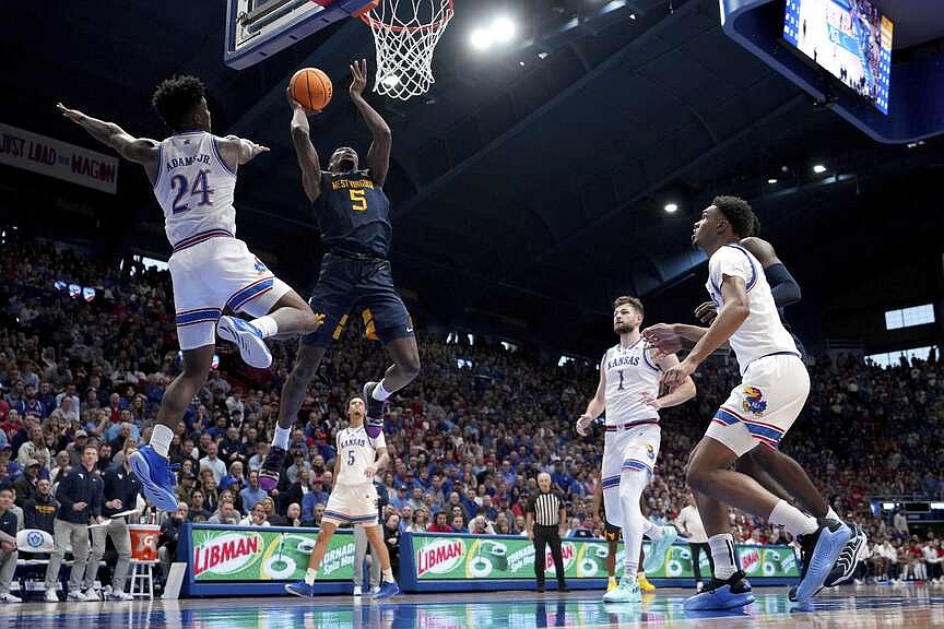 Despite travel issues, West Virginia wins at Kansas | Arkansas Democrat Gazette