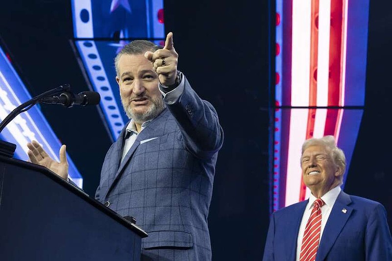 U.S. Sen. Ted Cruz, R-Texas, speaks as U.S. President-elect Donald Trump listens during Turning Point USA's AmericaFest at the Phoenix Convention Center on Dec. 22, 2024, in Phoenix. (Rebecca Noble/Getty Images/TNS)