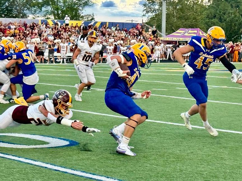 Lakeside and Lake Hamilton face off on Aug. 30 at Chick Austin Stadium as senior running back Grady Ohman (44) carries the ball and senior linebacker Hagan Tyler (10) pursues on defense. The Rams won 34-29. (The Sentinel-Record/Bryan Rice)