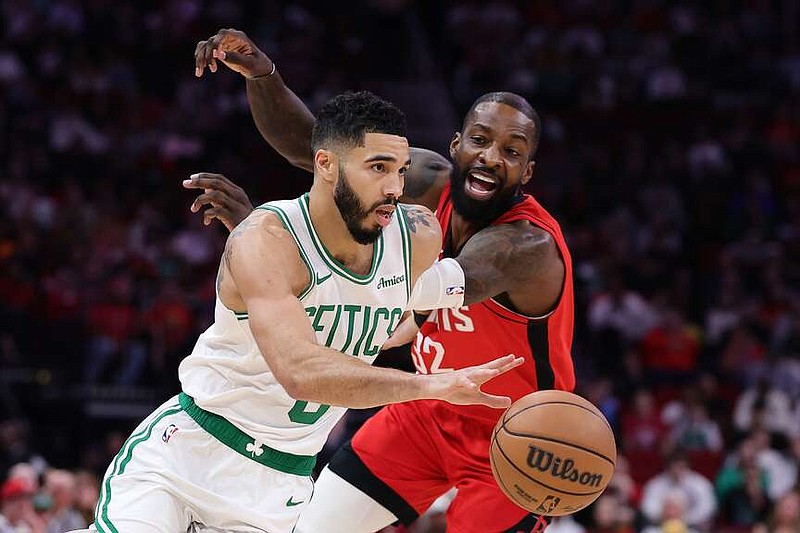 The Boston Celtics' Jayson Tatum (0) works against the Houston Rockets' Jeff Green (32) during the first half at Toyota Center on Friday, Jan. 3, 2025, in Houston. (Alex Slitz/Getty Images/TNS)