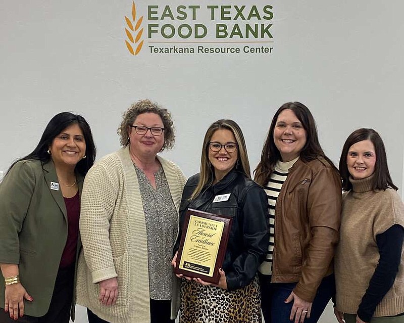 Amber Adams, center, holds the Community Leadership Award of Excellence as she poses for a recent photo with, from left, Dr. Jennifer Davis, Dr. Lisa Myers, Rachael Cherry and Tina Reed. The award was presented by the Texas A&M-Texarkana School of Professional Education and Community Service. Adams, an A&M-Texarkana alumna with a Bachelor of Science in Leadership, is the director of Texarkana Engagement at East Texas Food Bank. "In her role, Amber has demonstrated an extraordinary ability to foster collaboration and develop initiatives that address critical issues like food insecurity in East Texas," the university said in a news release. (Photo courtesy of A&M-Texarkana)