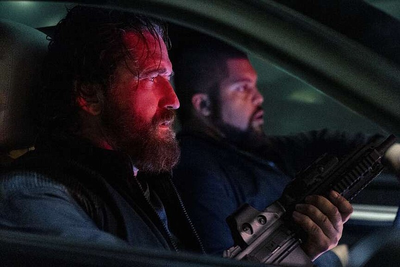 Gerard Butler as 'Big Nick' O'Brien and O'Shea Jackson Jr. as Donnie Wilson in "Den of Thieves 2: Panthera." (Rico Torres/Lionsgate/TNS)