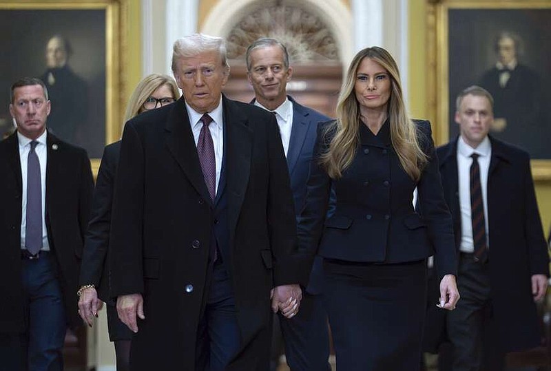 President-elect Donald Trump walks with Melania Trump at the Capitol on Wednesday, Jan. 8, 2025, in Washington, followed by Senate Majority Leader John Thune, R-S.D. (AP Photo/Jose Luis Magana)