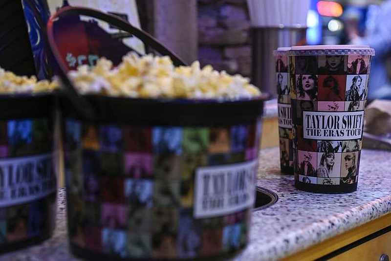 A collection bucket and cup for "Taylor Swift: The Eras Tour" film is sold Oct. 13, 2023, at Regal Cinemas in Lynchburg, Va. (Paige Dingler/The News & Advance via AP, File)