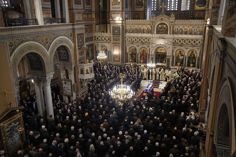 Relatives and officials attend the state funeral of the late Costas Simitis former Prime Minister of Greece in Athens' central cathedral, Thursday, Jan. 9, 2025. (AP Photo/Petros Giannakouris)