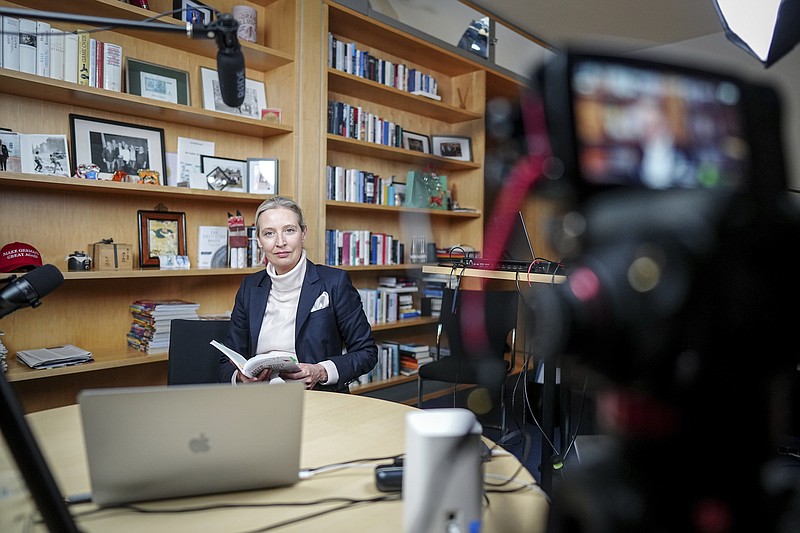 Alice Weidel, parliamentary group leader, party chairwoman and candidate for chancellor of the AfD, prepares for a live X interview with U.S. billionaire Elon Musk in her office in the Jakob Kaiser House in Berlin, on Thursday, Jan. 9, 2025. (Kay Nietfeld/Pool Photo via AP)