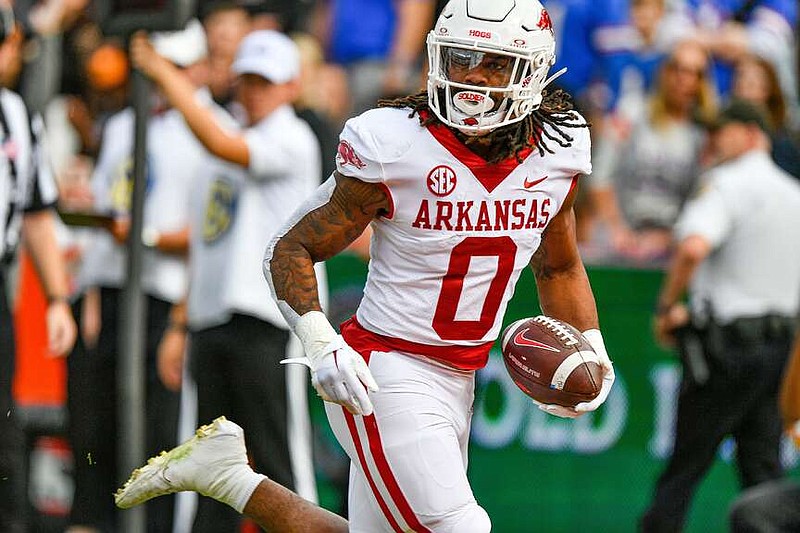 Arkansas running back AJ Green (0) catches a touchdown pass, Nov. 4, 2023, during the first quarter of the Razorbacks' 39-36 overtime win over the Florida Gators at Ben Hill Griffin Stadium in Gainesville, Fla. (NWA Democrat-Gazette/Hank Layton)