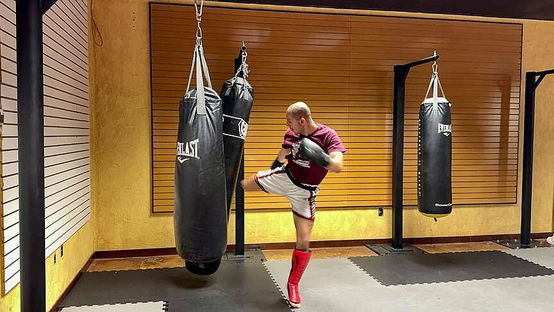 Hayden Hernandez kicks a bag at the Real Deal Championship gym on Wednesday. Real Deal Championship will host RDC 17 on Saturday at the Arkansas State Fairgrounds. (The Sentinel-Record/Bryan Rice)