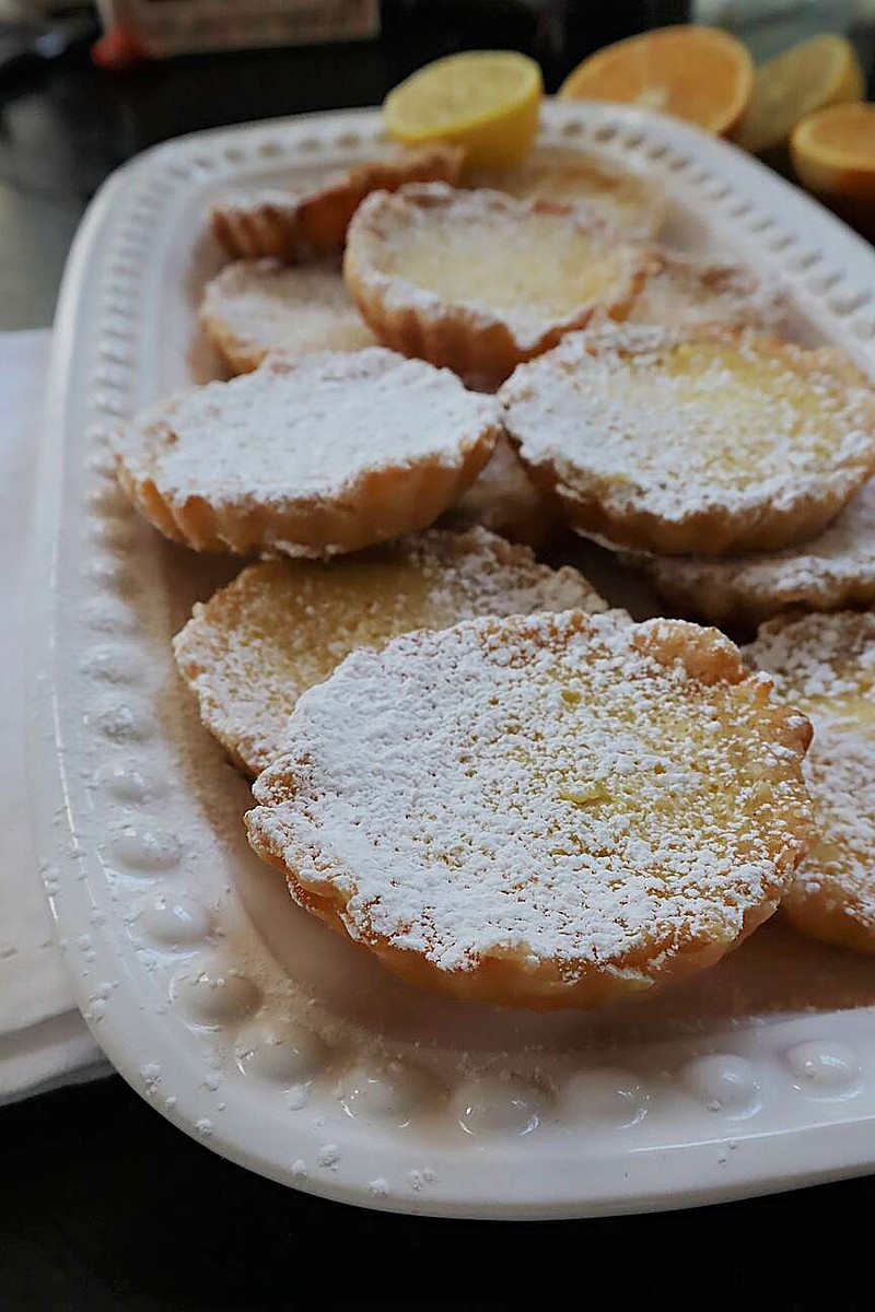 These seasonal citrus tartlets have a silky lemon-orange custard filling and a buttery pastry crust. (Gretchen McKay/Pittsburgh Post-Gazette/TNS)