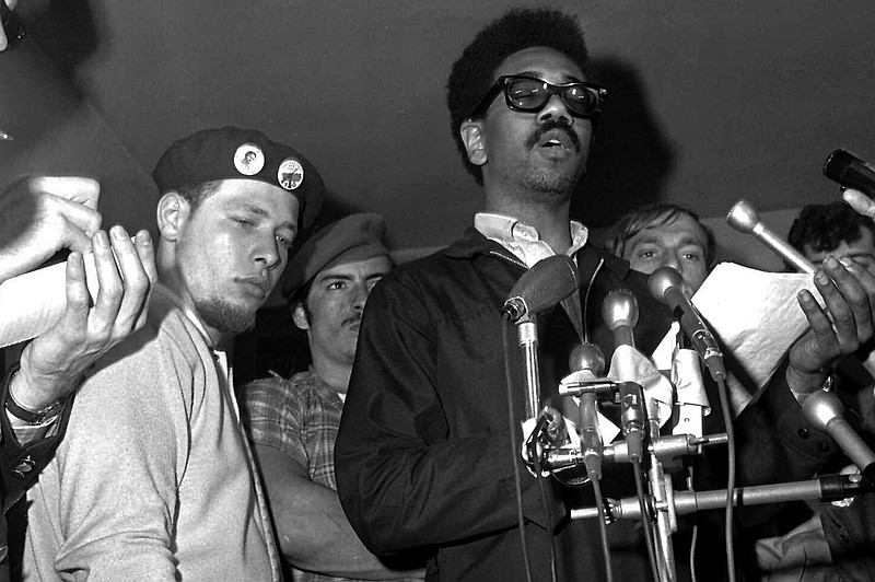 FILE - Puerto Rican Jose &#x201c;Cha Cha&#x201d; Jimenez, left, founder of the Young Lords in Chicago-area Puerto Rican group, attends a news conference led by Bobby Rush, deputy defense minister of the Illinois Black Panther party, in Chicago, June 4, 1969. Jim&#xe9;nez, a prominent civil rights and liberation movement figure died at the age of 76 his sister announced Friday,  Jan. 10, 2025. (AP Photo/EK, File)