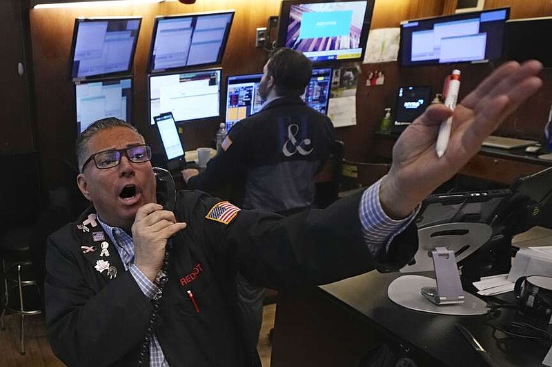 Trader Jonathan Mueller works on the floor of the New York Stock Exchange, Monday, Jan. 13, 2025. (AP Photo/Richard Drew)