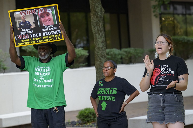 FILE - From left, Lumumba Lutalo, Angela &quot;Mama Ghost&quot; Green and Antonia Mar, of New Orleans for Community Oversight of Police, take part in a rally for justice for Ronald Greene at the Eastern District of Louisiana Courthouse in New Orleans, on May 10, 2024. (AP Photo/Matthew Hinton, File)