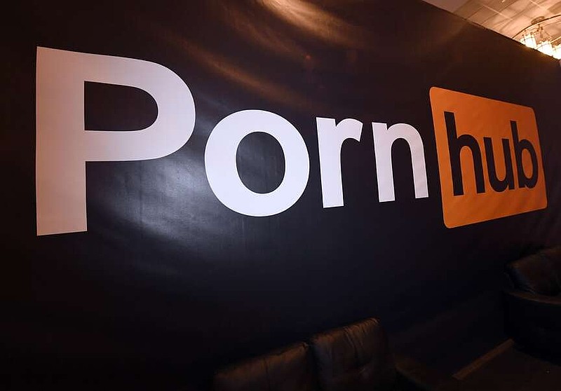 A Pornhub logo is displayed at the company's booth at the AVN Adult Entertainment Expo at the Hard Rock Hotel & Casino on Jan. 24, 2018, in Las Vegas. (Ethan Miller/Getty Images/TNS)