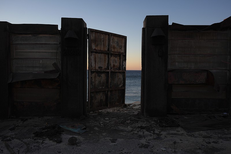 A beach front home destroyed by the Palisades Fire is seen in Malibu, Calif., Wednesday, Jan. 15, 2025. (AP Photo/Jae C. Hong)