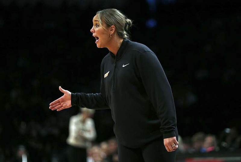 FILE - Tennessee head coach Kim Caldwell yells from the bench during the second half of an NCAA college basketball game against Iowa, Dec. 7, 2024, in New York. (AP Photo/John Munson, File)