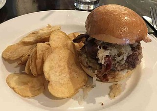 The Nuremberger, a brat patty with sauerkraut and bacon, from the Pantry West (Arkansas Democrat-Gazette/Kimberly Dishongh)