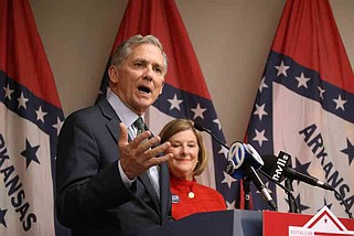 U.S. Rep. French Hill talks to supporters with his wife, Martha, at the Republican Party of Arkansas Headquarters in Little Rock in this Nov. 5, 2024 file photo. (Arkansas Democrat-Gazette/Thomas Metthe)