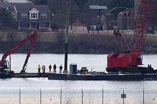 Engine, large portion of jet recovered from river by salvage crews ...