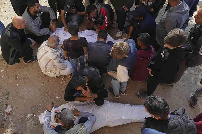 The Palestinians mourn the corpses of their relatives, which were killed on Saturday, March 15, 2025, by an Israeli air raid in Beit Lahiya, Northern Gaza Strip. (AP Photo/Jehad Alshrafi)