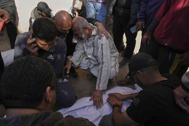 The Palestinians mourn the corpses of their relatives, which were killed on Saturday, March 15, 2025, by an Israeli air raid in Beit Lahiya, Northern Gaza Strip. (AP Photo/Jehad Alshrafi)