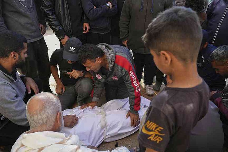 The Palestinians mourn the corpses of their relatives, which were killed on Saturday, March 15, 2025, by an Israeli air raid in Beit Lahiya, Northern Gaza Strip. (AP Photo/Jehad Alshrafi)