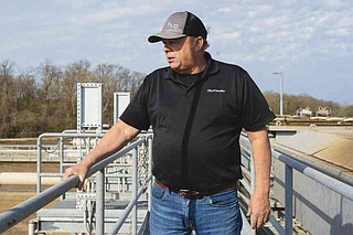 James Freeling Decatur James Boston, Decatur's public works director, looks into a water ...