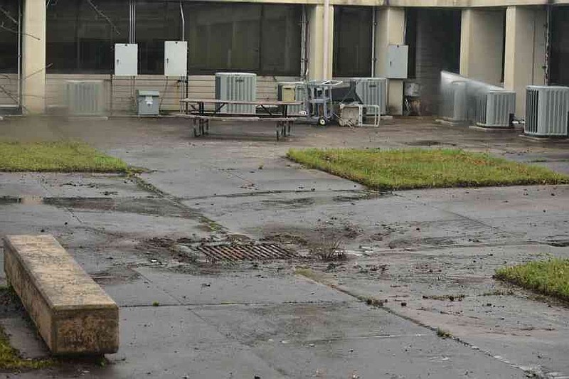 An enclosed courtyard where flooding settled and then seeped into the hallways at Pine Bluff High School's Jack Robey campus is pictured Friday, April 4, 2025. (Pine Bluff Commercial/I.C. Murrell)