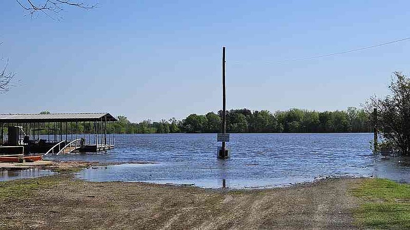 The Arkansas River at Riverside Road in Pine Bluff partially covers the ramp Tuesday, April 8, 2025. (Pine Bluff Commercial/I.C. Murrell)