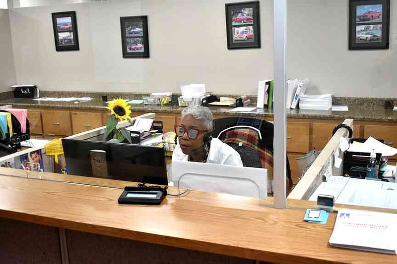 Jefferson County Assessor Gloria Tillman fields a phone call in an empty property tax office in May 2024. Many county employees took off from work in protest of missed payroll. (Pine Bluff Commercial/I.C. Murrell)