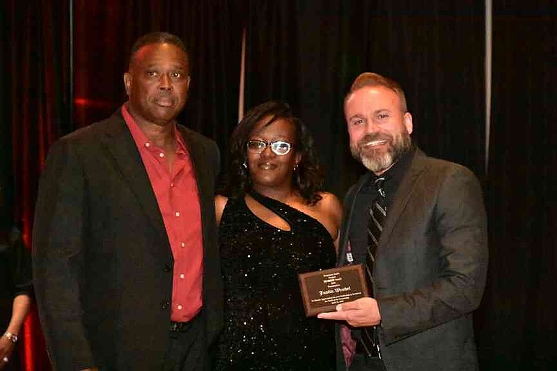 Justin Wendel, right, pastor of Pursuit Church in White Hall, receives his Be Great Award from Ben Redix Sr. and Shaneisha Robinson. (Pine Bluff Commercial/I.C. Murrell)