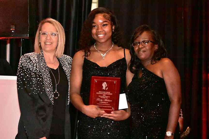 Watson Chapel High School senior Trinity Mitchner, center, is presented the Benjamen Redix Memorial Scholarship award. She poses with Michelle Burchett of the Benjamen Redix Project and Shaneisha Robinson, Redix's mother and BRP founder. (Pine Bluff Commercial/I.C. Murrell)