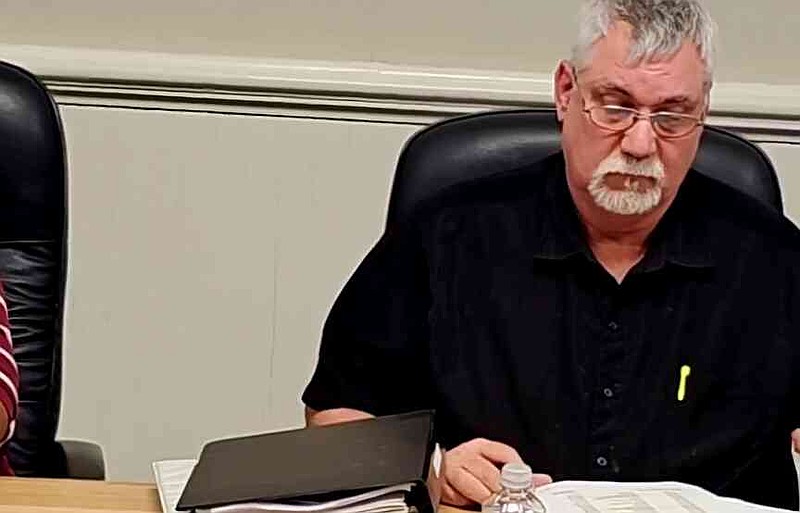 Justice of the Peace Richard Victorino looks over the proposed 2025 budget. (Pine Bluff Commercial/Eplunus Colvin)