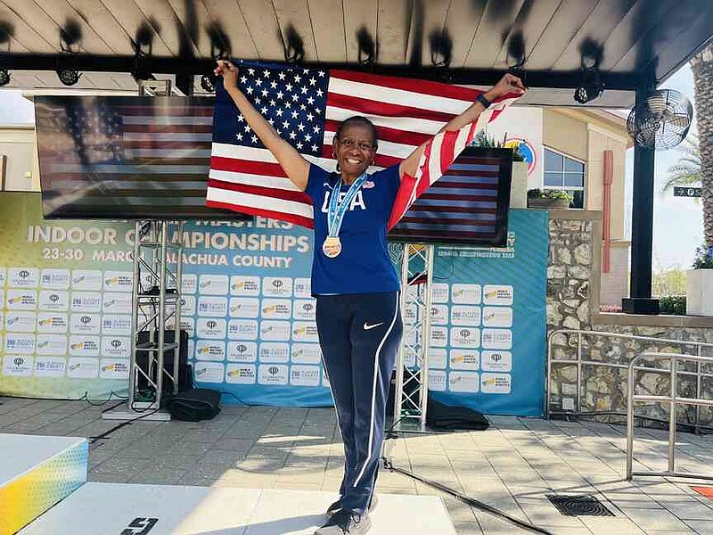 Vickie Liddell celebrates after winning the bronze medal for the long jump. (Special to The Commercial)