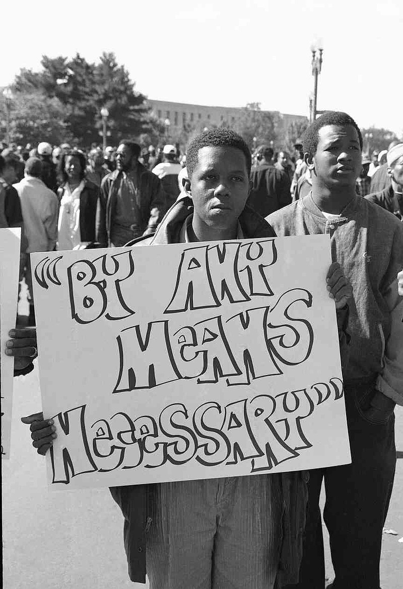 'By Any Means Necessary' ties the 1990s Million Man March to the Civil Rights struggles of the 1950s and 1960s, illustrating the changes yet pointing out the remaining inequality and stereotypical image of American black men. By any means necessary was a popular mantra used during the Civil Rights Era. (Special to The Commercial/Roderick 'Rod' Terry)