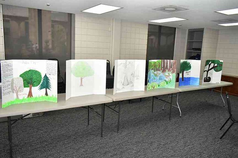 Illustrations of tree ecosystems by Pine Bluff High School environmental science are displayed inside the Collins Center. (Pine Bluff Commercial/I.C. Murrell)
